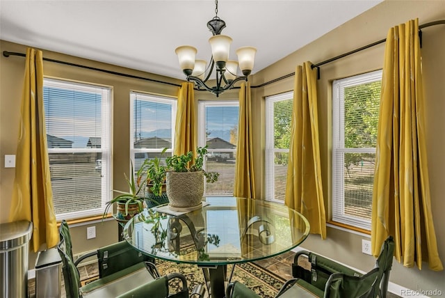 dining area featuring an inviting chandelier