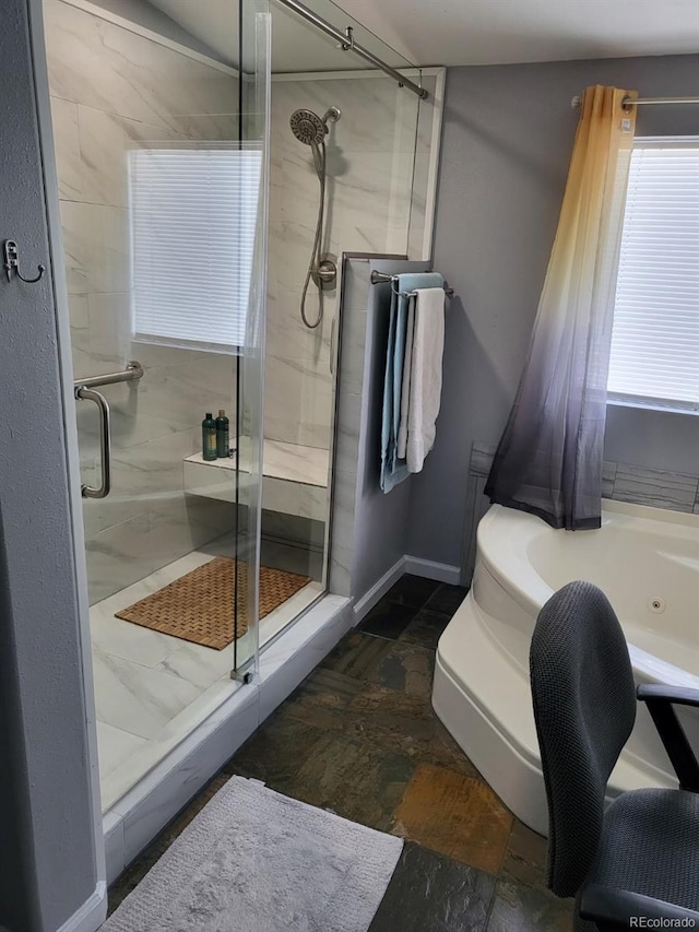 bathroom with separate shower and tub