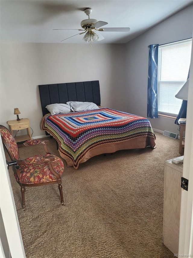 carpeted bedroom with ceiling fan