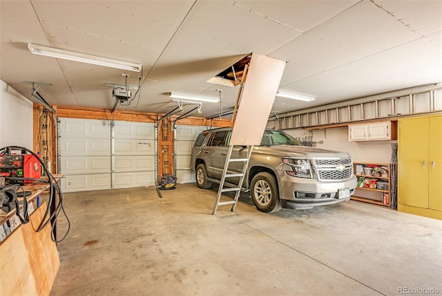 garage featuring a garage door opener