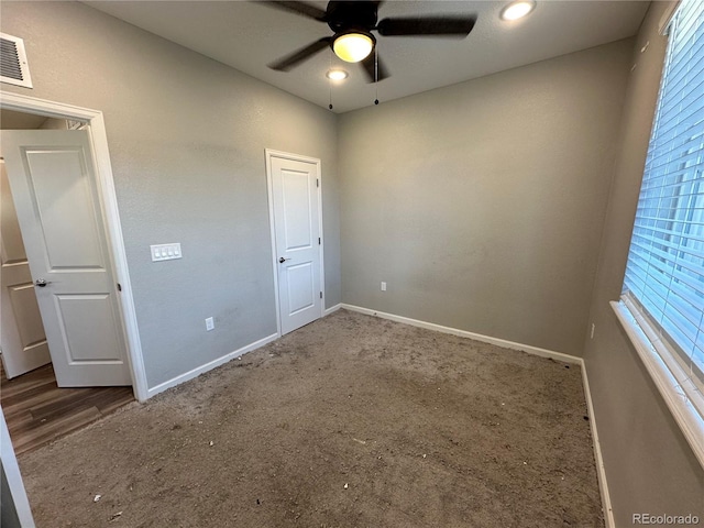 unfurnished bedroom with carpet floors and ceiling fan