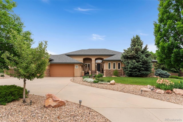3806 S Dawson St, Aurora, CO 80014 - view of front of home featuring driveway, an attached garage, stucco siding, a front yard, and roof with shingles
