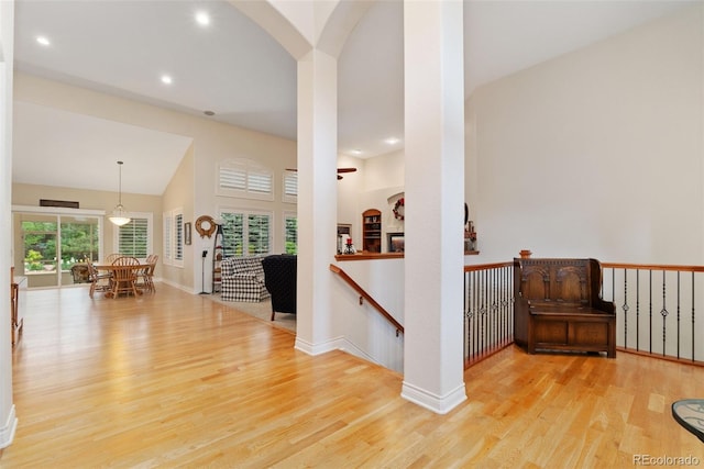 3806 S Dawson St, Aurora, CO 80014 - corridor with wood finished floors, plenty of natural light, an upstairs landing, recessed lighting, and arched walkways