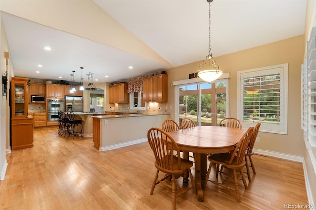 3806 S Dawson St, Aurora, CO 80014 - dining room featuring light wood-style floors, vaulted ceiling, recessed lighting, and baseboards