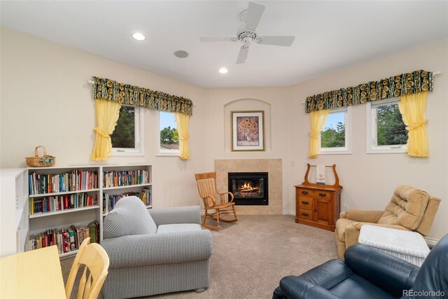 3806 S Dawson St, Aurora, CO 80014 - living room featuring a ceiling fan, a tiled fireplace, carpet flooring, and recessed lighting
