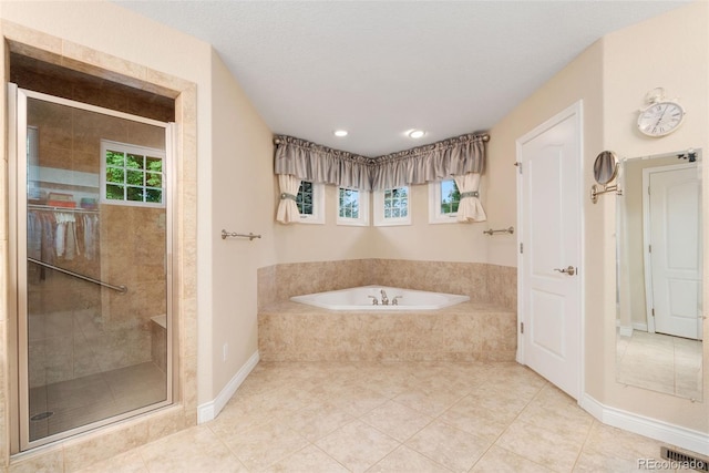 3806 S Dawson St, Aurora, CO 80014 - full bath with tile patterned floors, a bath, a stall shower, baseboards, and recessed lighting