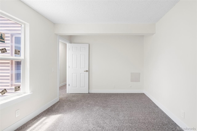1519 S Sable Blvd Unit C, Aurora, CO 80012 - unfurnished room featuring carpet, a textured ceiling, and baseboards