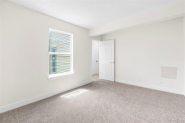 1519 S Sable Blvd Unit C, Aurora, CO 80012 - unfurnished room with carpet flooring, a textured ceiling, and baseboards