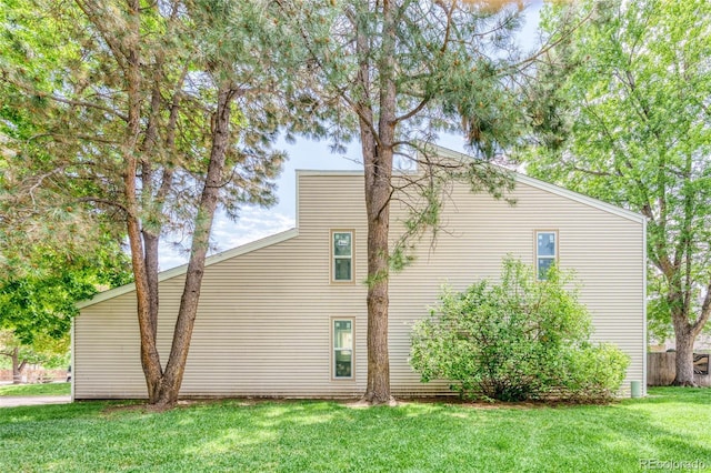 1519 S Sable Blvd Unit C, Aurora, CO 80012 - view of home's exterior with a lawn