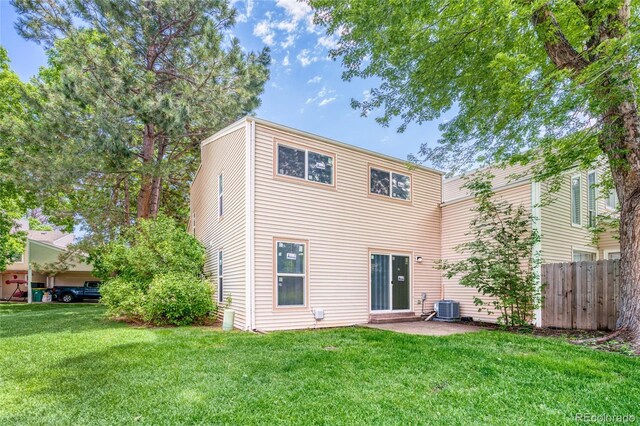 1519 S Sable Blvd Unit C, Aurora, CO 80012 - rear view of house with cooling unit and a patio area