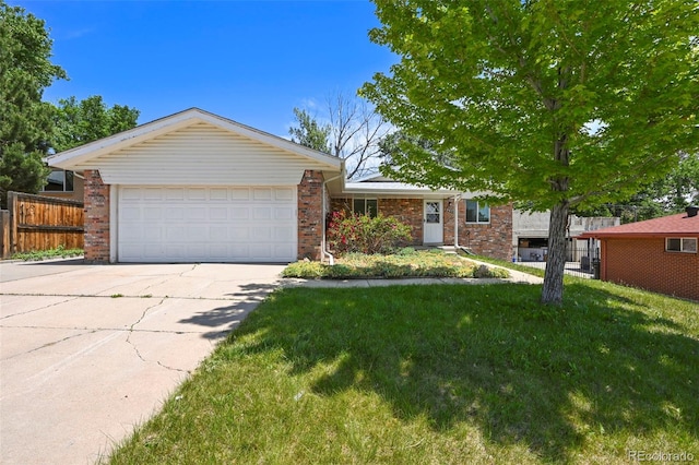 6432 Zephyr St, Arvada, CO 80004 - single story home featuring brick siding, concrete driveway, and an attached garage