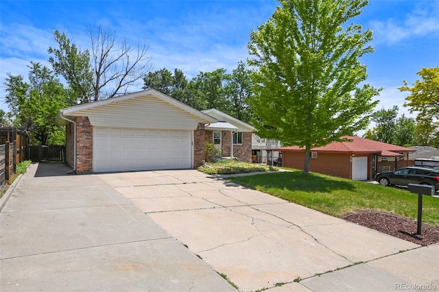 6432 Zephyr St, Arvada, CO 80004 - single story home with concrete driveway, an attached garage, and brick siding