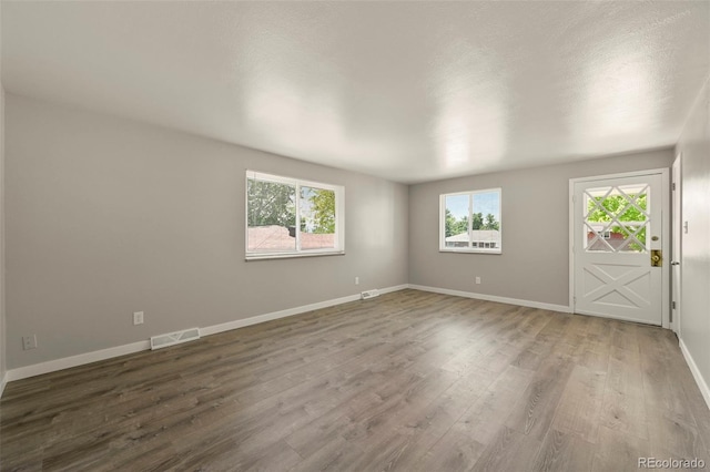 6432 Zephyr St, Arvada, CO 80004 - empty room with wood finished floors and baseboards