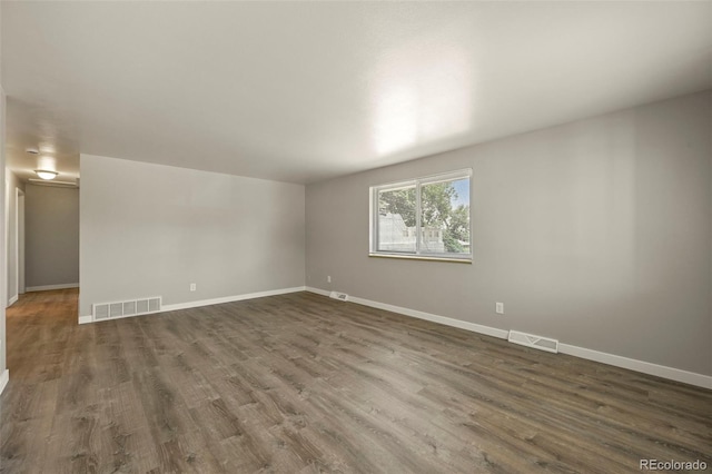 6432 Zephyr St, Arvada, CO 80004 - empty room featuring dark wood-style floors and baseboards