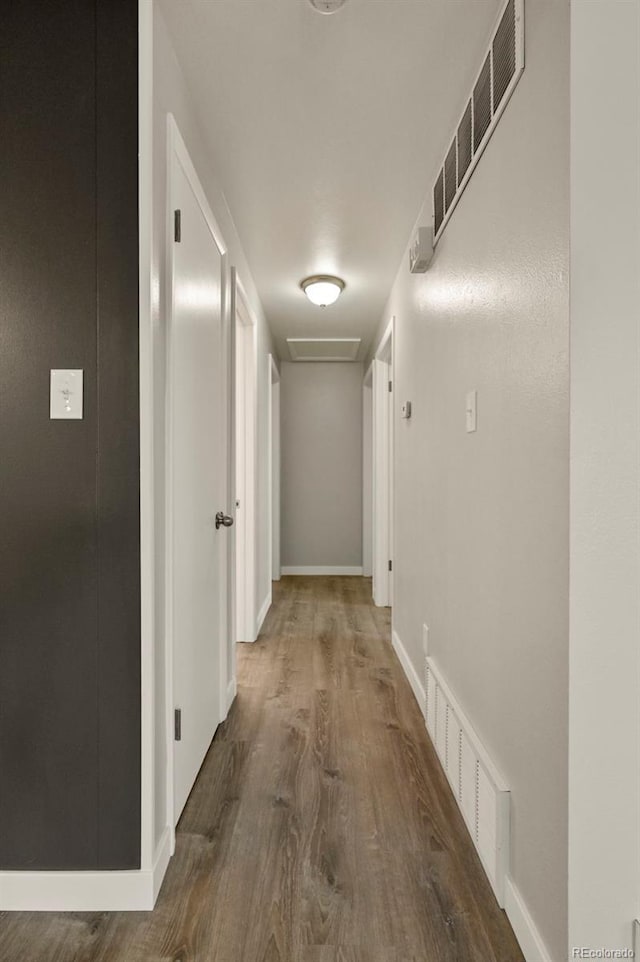 6432 Zephyr St, Arvada, CO 80004 - hallway with wood finished floors and baseboards