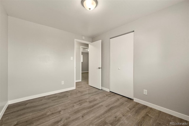 6432 Zephyr St, Arvada, CO 80004 - unfurnished bedroom featuring wood finished floors, baseboards, and a closet