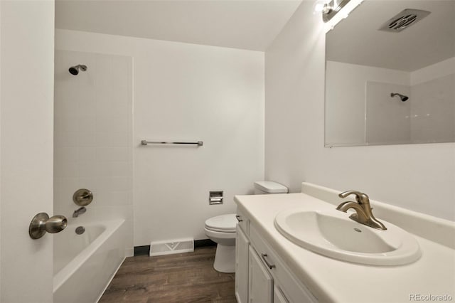 6432 Zephyr St, Arvada, CO 80004 - bathroom with toilet, wood finished floors, vanity, and  shower combination