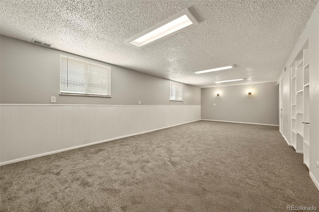 6432 Zephyr St, Arvada, CO 80004 - spare room featuring a textured ceiling and carpet flooring