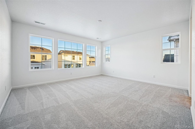 unfurnished room with carpet flooring