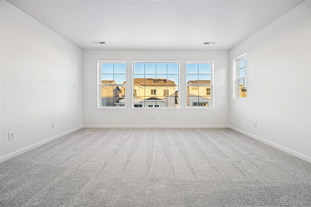 unfurnished room with carpet flooring