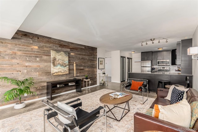 1121 Albion St Unit 809, Denver, CO 80220 - living room with wood walls and finished concrete floors