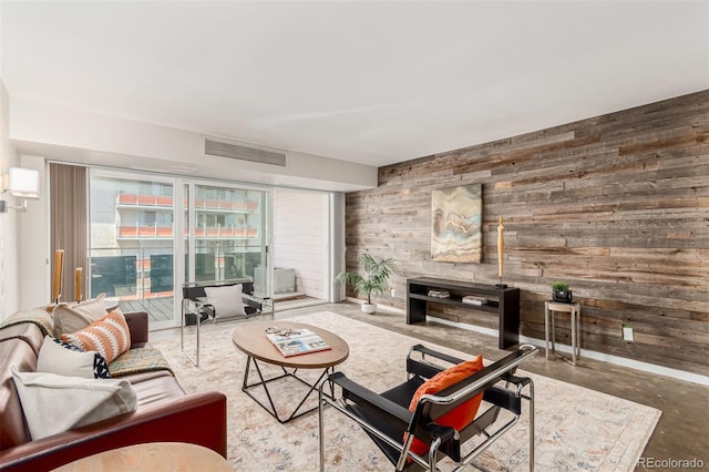 1121 Albion St Unit 809, Denver, CO 80220 - living room featuring wooden walls and concrete floors