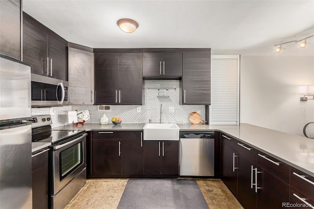 1121 Albion St Unit 809, Denver, CO 80220 - kitchen featuring stainless steel appliances, backsplash, a sink, and dark brown cabinets