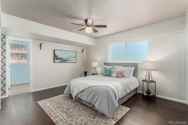 1121 Albion St Unit 809, Denver, CO 80220 - bedroom with multiple windows, dark wood finished floors, baseboards, and a ceiling fan