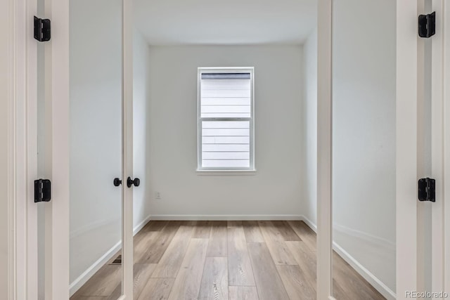 spare room with light wood-type flooring