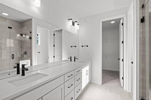 bathroom featuring walk in shower and vanity