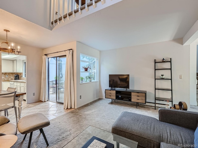 living room with a chandelier and light tile patterned floors