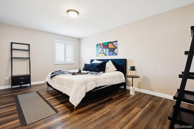 bedroom with dark hardwood / wood-style flooring