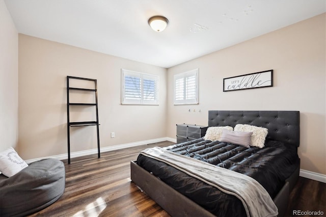 bedroom with dark wood-type flooring