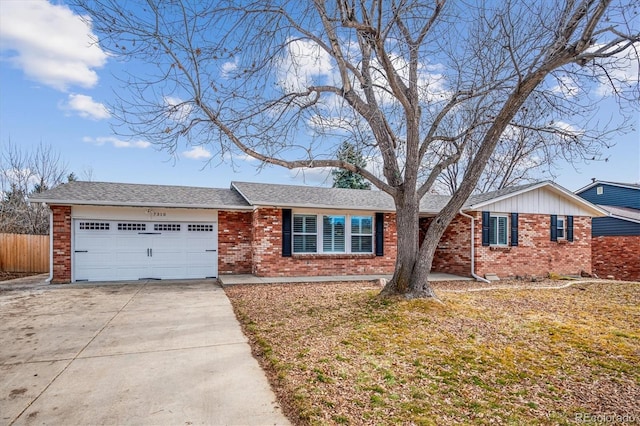 single story home with a garage and a front lawn