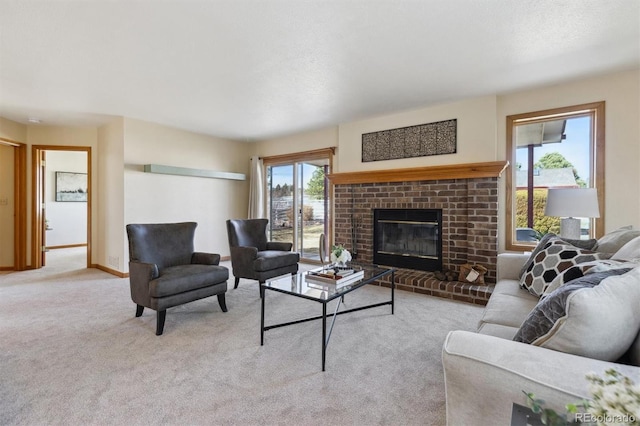 living area featuring baseboards, carpet floors, and a fireplace