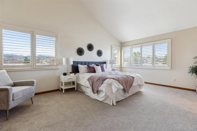 bedroom with high vaulted ceiling, baseboards, and carpet
