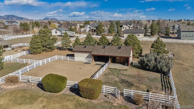 birds eye view of property with a residential view and a mountain view