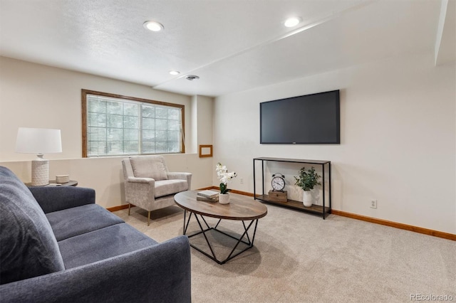living area featuring light carpet, recessed lighting, and baseboards