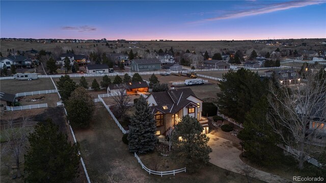 aerial view at dusk with a residential view