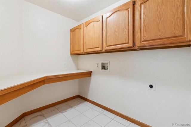 washroom featuring hookup for a washing machine, cabinet space, baseboards, and hookup for an electric dryer