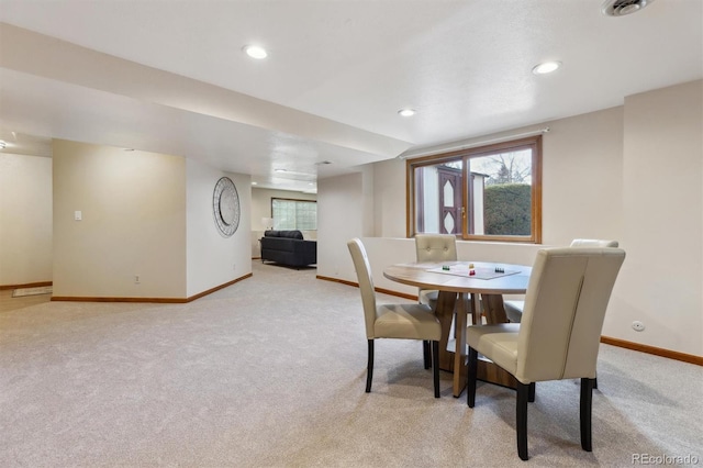 dining area featuring light carpet, recessed lighting, and baseboards