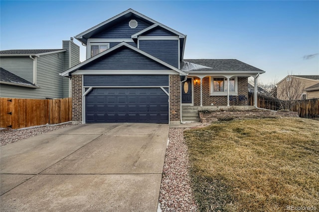 view of front of house with a garage and a front lawn