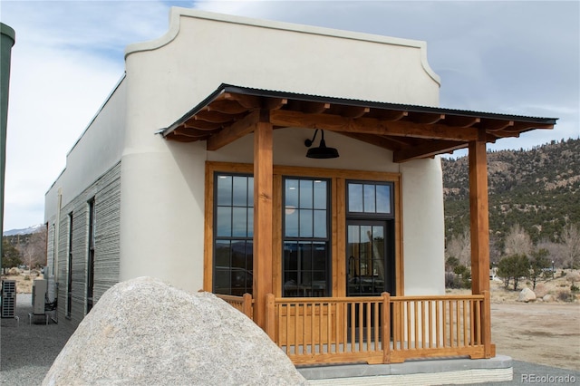 property entrance with stucco siding