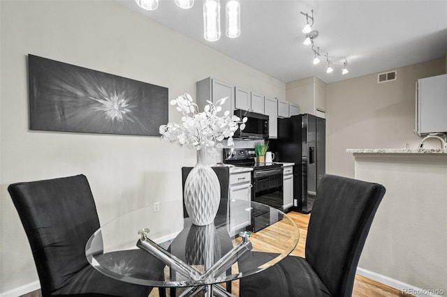 dining room featuring light hardwood / wood-style floors