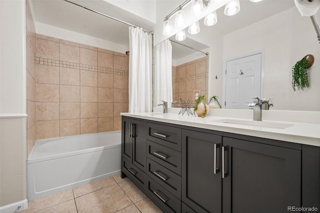 bathroom featuring tile patterned flooring, shower / tub combo, and vanity