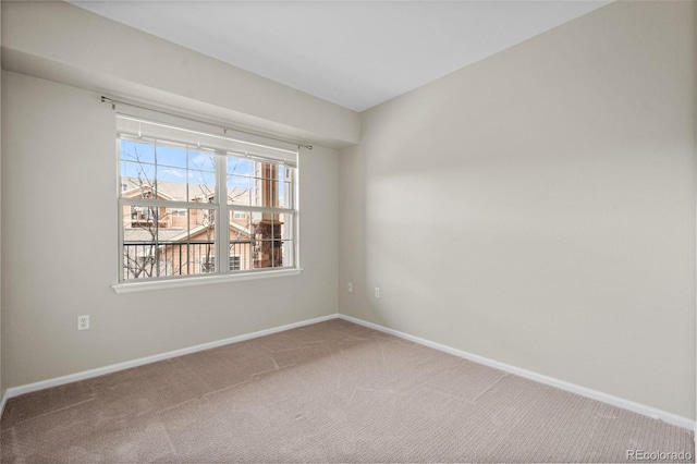 spare room featuring carpet floors