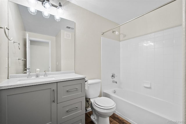 full bathroom with hardwood / wood-style flooring, vanity, toilet, and bathing tub / shower combination