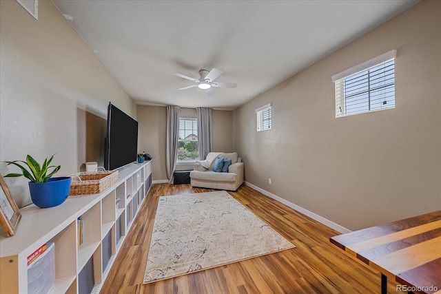 23831 Eagle Bend Ln, Parker, CO 80138 - sitting room with light wood finished floors, ceiling fan, and baseboards