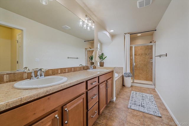 23831 Eagle Bend Ln, Parker, CO 80138 - bathroom featuring a shower stall, double vanity, a garden tub, tile patterned floors, and baseboards
