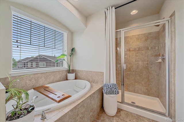 23831 Eagle Bend Ln, Parker, CO 80138 - bathroom featuring a shower stall, a garden tub, healthy amount of natural light, and tile patterned floors